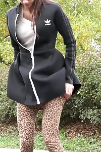 Brunette Beauty In Pants Pisses Outside